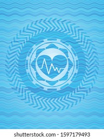 heart with electrocardiogram icon inside light blue water wave emblem background.