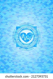 heart with electrocardiogram icon inside light blue mosaic emblem. 