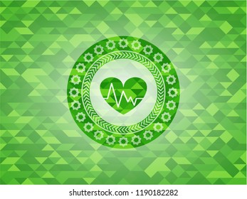 heart with electrocardiogram icon inside realistic green mosaic emblem