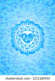 heart with electrocardiogram icon inside realistic sky blue mosaic emblem