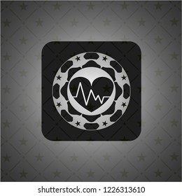 heart with electrocardiogram icon inside realistic dark emblem