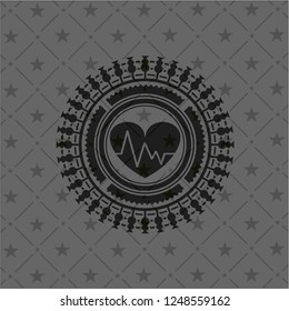 heart with electrocardiogram icon inside realistic black emblem