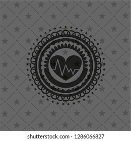 heart with electrocardiogram icon inside realistic black emblem