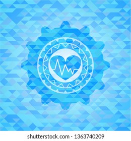 heart with electrocardiogram icon inside realistic light blue mosaic emblem