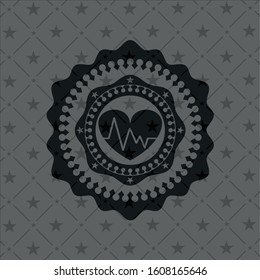 heart with electrocardiogram icon inside realistic black emblem