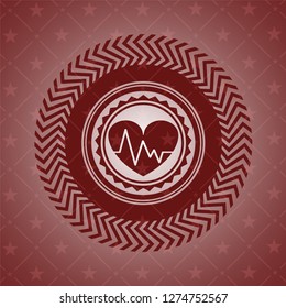 heart with electrocardiogram icon inside retro red emblem