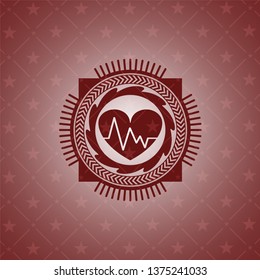 heart with electrocardiogram icon inside retro style red emblem