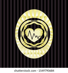 heart with electrocardiogram icon inside shiny emblem