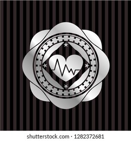 heart with electrocardiogram icon inside silver emblem