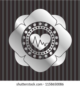 heart with electrocardiogram icon inside silvery shiny badge