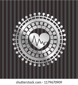 heart with electrocardiogram icon inside silvery badge or emblem