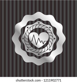heart with electrocardiogram icon inside silvery emblem or badge