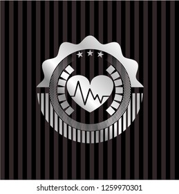 heart with electrocardiogram icon inside silvery shiny badge