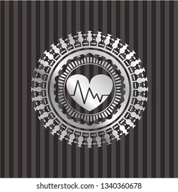 heart with electrocardiogram icon inside silvery badge or emblem