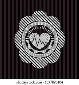 heart with electrocardiogram icon inside silvery shiny emblem