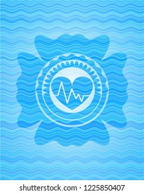 heart with electrocardiogram icon inside water representation badge background.