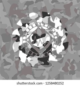 heart with electrocardiogram icon on grey camouflage pattern