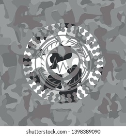 heart with electrocardiogram icon on grey camouflaged texture