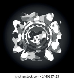 heart with electrocardiogram icon on grey camouflaged pattern