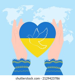 Heart flag of Ukraine with a dove of peace, in female hands. Concept - no war in Ukraine.