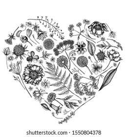 Heart floral design with black and white shepherd's purse, heather, fern, wild garlic, clover, globethistle, gentiana, astilbe, craspedia, lagurus, black caraway, chamomile, dandelion and poppy flower