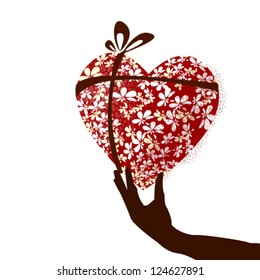 heart of flowers in hand