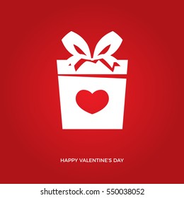 heart in front of the of the box with ribbon