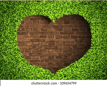 el corazón de la hierba sobre fondo de ladrillo