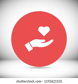 Heart in hand icon vector