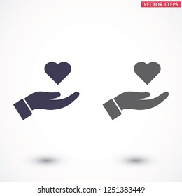 Heart in hand icon vector