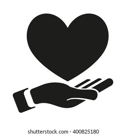 Heart In Hand isolated black icon.