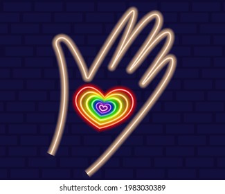 Heart in hand of neon in rainbow color. LGBT neon sign vector design template. Gay Pride neon element. LGBT pride symbol. Vector illustration.