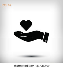 heart in hand vector icon