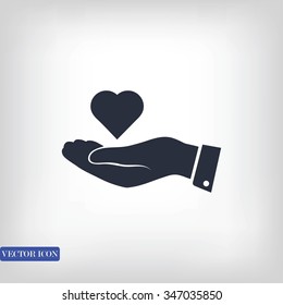 heart in hand vector icon