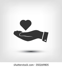 heart in hand vector icon