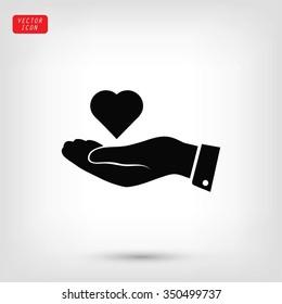 heart in hand vector icon