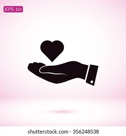 heart in hand vector icon