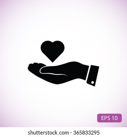 heart in hand vector icon