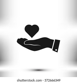 heart in hand vector icon