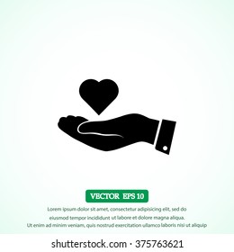 heart in hand vector icon