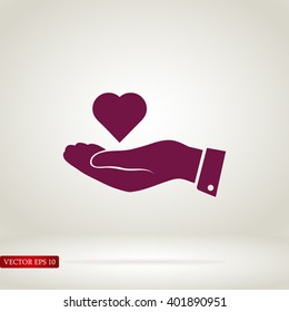 heart in hand vector icon