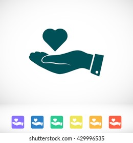 heart in hand vector icon
