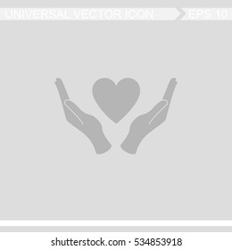 Heart in hand vector icon.