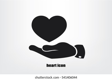 Heart in hand vector icon