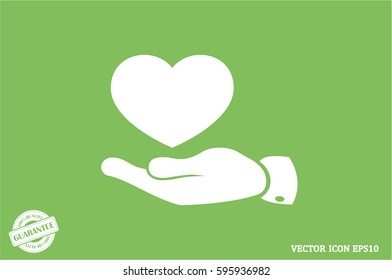 Heart in hand vector icon.