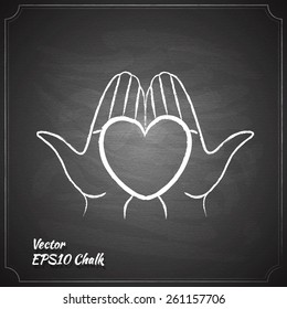 heart in hands chalk painted on the chalkboard medicine symbol vector illustration