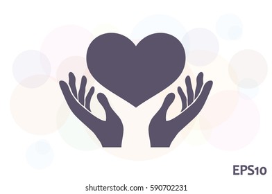 Heart in the hands vector icon 