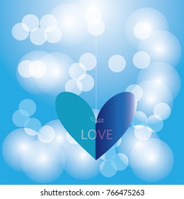 Heart hanging by a rope background bokeh.