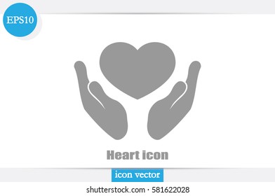 Heart icon in the hands vector 