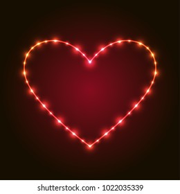 Heart with lights on red dark background for valentine and wedding card.